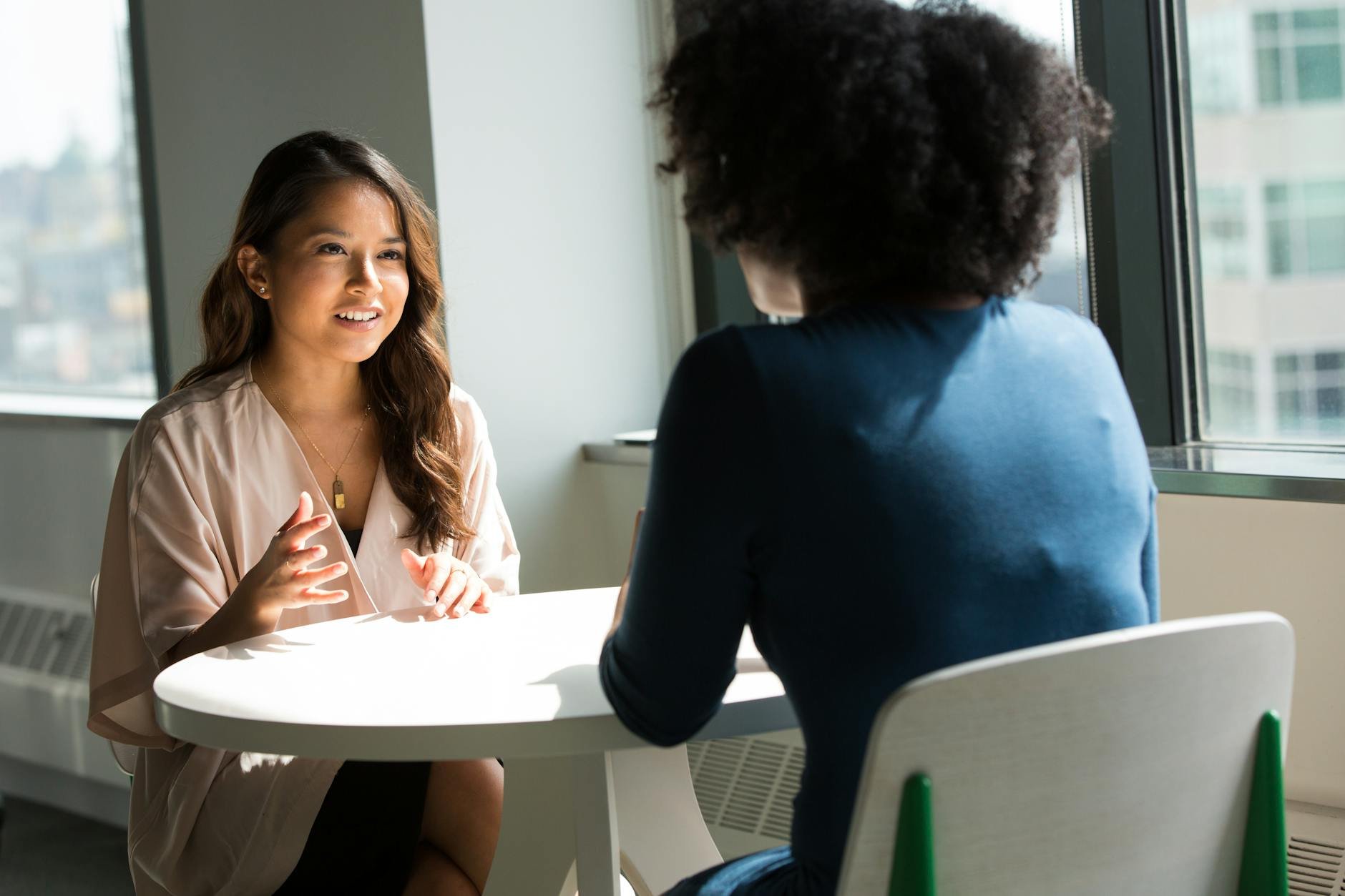 Professional women in business discussion — MAMAJI